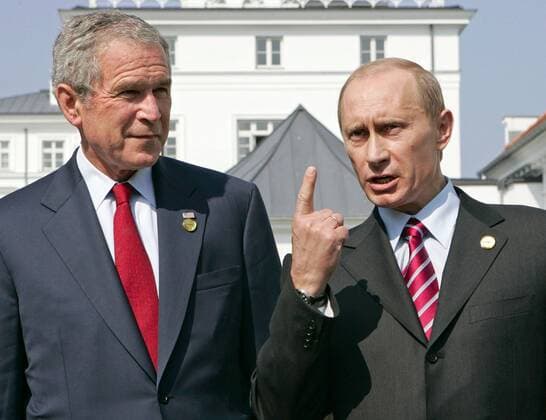 ITAR-TASS 171: HEILIGENDAMM, GERMANY. JUNE 7. Russian President Vladimir Putin, right, gestures as he and U.S. President George Bush speak after a bilateral meeting in the Kurhaus complex at the G8 summit in Heiligendamm, Germany.  481287