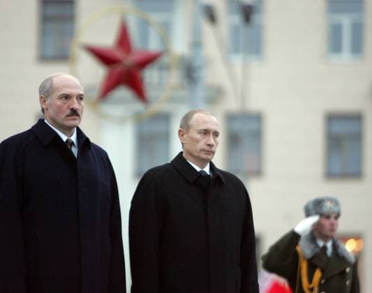ITAR-TASS 95: MINSK, BELARUS. DECEMBER 14. Belarus President Aleksander Lukashenko and Russian President Vladimir Putin (L-R) seen during the wreath laying ceremony at the Victory Monument in Victory Square.  542879