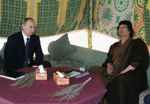 ITAR-TASS 167: TRIPOLI, LIBYA. APRIL 17. Russian president Vladimir Putin (L), and Libyan leader Muammar al-Gaddafi during talks in Qaddafi s residence within the Bab al Azizia barracks.  591499