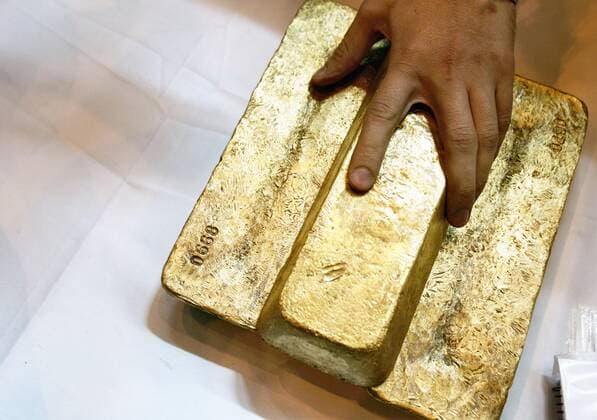 ITAR-TASS 33: KRASNOYARSK TERRITORY, RUSSIA. JULY 17. Bars of gold produced by Polyus Gold s Olimpiada gold mine in North Yenisei District, Krasnoyarsk Territory.  494001