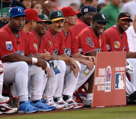 11 July, 2010: Bo Jackson (L), MC Hammer (3rd L), Rollie Fingers, Michael Clarke Duncan (2nd R) watch the softball game from the bench during the Taco Bell All-Star Legends and Celebrity Softball Game played at Angel Stadium of Anaheim. EDITORIAL USE ONLY 117956