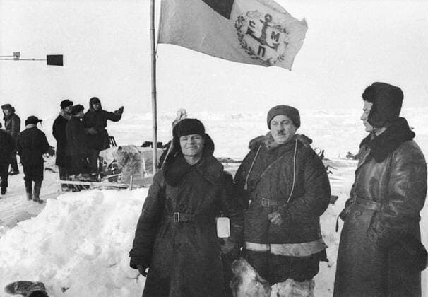 Pilot G.P. Vlasov, researcher Ivan Papanin and head of the Taimyr icebreaker expedition, A. Ostaltsev (L-R) are on the North Pole-1 floating station, 1937.  190512