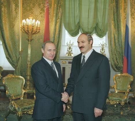 MOSCOW, January 26 Acting Russian President and Prime Minister Vladimir Putin (left) shakes hands with Belarussian President Alexander Lukashenko prior to their meeting in the Green Hall of the Grand Kremlin Palace on Wednesday.  194582