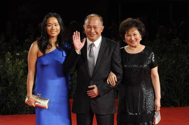 67th Venice Film Festival. Friday, 2010 September 03, Venice ITALY - In The Picture: The film director John Woo with Angeles Johon (L) and his wife Annie Woo on the red carpet for the premiere of the film JIANYU (REIGN OF ASSASSINS)  stefanoxmicozzi