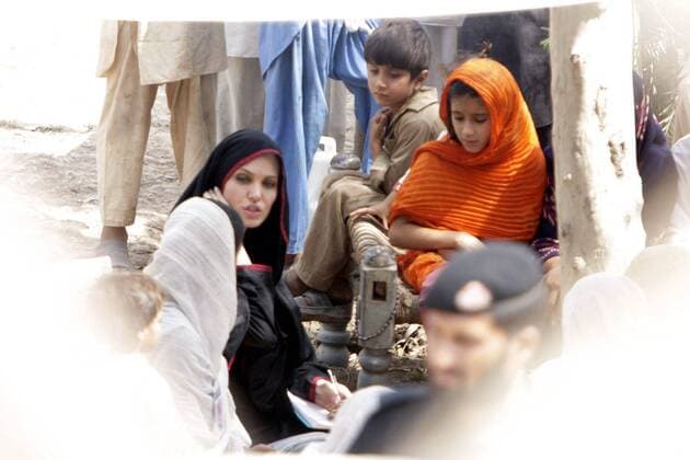 (100907) -- NOWSHERA (PAKISTAN), Sept. 7, 2010 (Xinhua) -- UN High Commissioner for Refugees (UNHCR) Goodwill Ambassador Angelina Jolie (3rd L) talks with a flood-affected family in the Mohib Bhanda area of northwest Pakistan s Nowshera, on Sept. 7, 2010. Jolie visited Pakistan to draw world s attention to the conditions of 21 million people influenced by the worst-ever floods in Pakistan, the UN refugee agency said. (Xinhua Umar Qayyum) (lr) (1)PAKISTAN-NOWSHERA-UNHCR GOODWILL AMBASSADOR-ANGELINA JOLIE-VISIT 