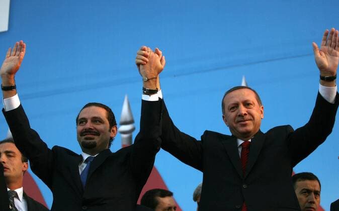 101124) -- BEIRUT, Nov. 24, 2010 (Xinhua) -- Lebanese Prime Minister Saad Hariri (L) and his Turkish counterpart Recep Tayyip Erdogan raise their hands during a public gathering in Lebanon, Nov. 24, 2010. Erdogan is on a two-day official visit to Lebanon. (Xinhua) (wjd) LEBANON-TURKEY-ERDOGAN-VISIT 