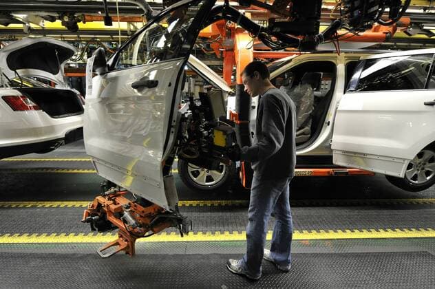 Workers installs doors on Ford Explorers and Tauruses and Lincoln MKZs at Ford s Chicago Assembly Plant on December 1, 2010 in Chicago. Ford spent nearly Dollar 400 million to renovate its Chicago facility to produce the all-new 2011 Explorer along with the Taurus and MKZ.  CHI2010120108