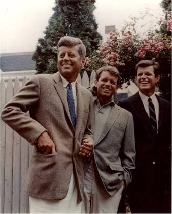 This photograph, part of the John F. Kennedy Presidential Library, taken in 1960 shows Brothers John F. Kennedy, Robert F. Kennedy, and Edward M. Kennedy (L-R) in Hyannis Port, Cape Cop, Massachusetts. This image is one of the more than 1,500 images that the National Archives has released in their Access to a Legacy project, which is an online digital archive of high interest material from President John F. Kennedy s official and personal records. The collection consist of photographs, audio recordings, speech drafts, films and other material.  WAX20110113304