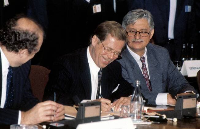Czechoslovakia s Premier Marian Calfa, left, and Foreign Minister Jiri Dienstbier, right, look on as President Vaclav Havel, centre, signs final documents formally ending the Warsaw Pact (Treaty) at the last session of its political committee in Prague on July 1, 1991. CTK Photo Michal Kalina  CTKPhoto00135439