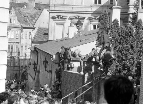 East German citizens climb over the wall to seek refuge at the West German Embassy in Prague in October 1989. CTK Photo  CTKPhoto00130804