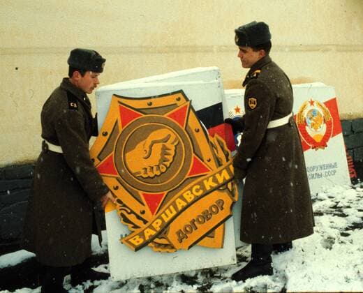 Soviet soldiers dismantle the Warsaw Pact emblem as they prepare for the withdrawal from Czechoslovakia at Frenstat pod Radhostem garrison on February 26, 1990.  CTKPhoto00235660