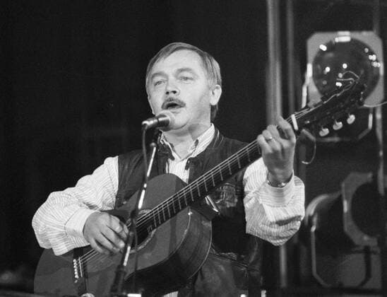 Karel Kryl, popular Czech singer-songwriter of protest songs, who returned home during Czechoslovakia Velvet revolution after 20 years in German exile, sings at the Concert for All Good People in Prague Sport Hall on December 3, 1989. CTK Photo Michal Dolezal  CTKPhoto01142028