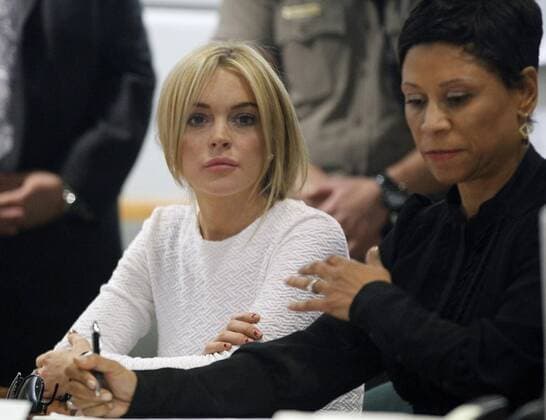 Actress Lindsay Lohan appears in court with her attorney Shawn Chapman Holley, as she pleads not guilty to a grand theft charge of stealing a $2,500 necklace from a jewelry store, in Los Angeles on February 9, 2011. Lohan is accused of walking out of a Los Angeles jewelry store without paying for a gold designer necklace in January -- just three weeks after ending her fifth stint in drug and alcohol rehab in three years.  LAP2011020920