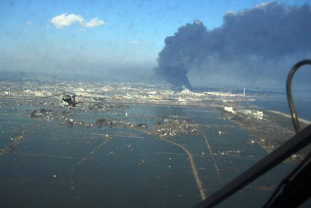 SENDAI, Japan (March 12, 2011) An SH-60B helicopter assigned to the Chargers of Helicopter Antisubmarine Squadron (HS) 14 from Naval Air Facility Atsugi flies over the city of Sendai to deliver more than 1,500 pounds of food to survivors of an 8.9 magnitude earthquake and a tsunami. The citizens of Ebina City, Japan, donated the food, and HS-14 is supporting earthquake and tsunami relief operations in Japan as directed.  ( 20114130)