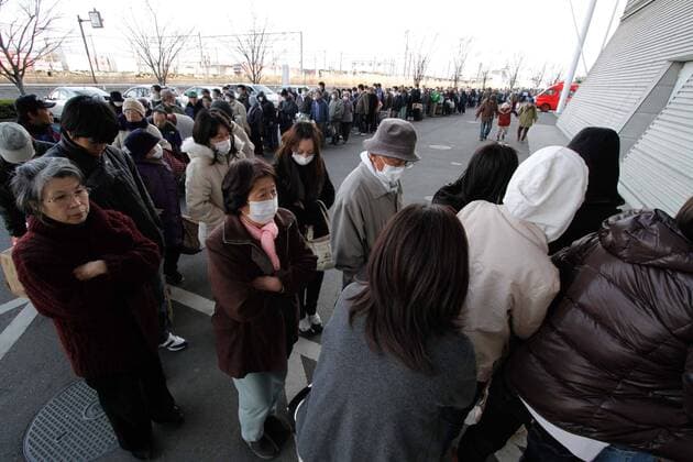 March 17, 2011, Koriyama, Japan - Residents arrive at a temporary shelter in Koriyama, , Fukushima prefecture, on Tuesday, March 15, 2011. Japanese government has issued evacuation orders to people living near a nuclear power, located on the Pacific coast some 35km southeast of Koriyama, which has been experiencing problems in its emergency cooling system since a magnitude 9.0 earthquake hit Japan s northeastern area on March 11.  ( uukb001017)