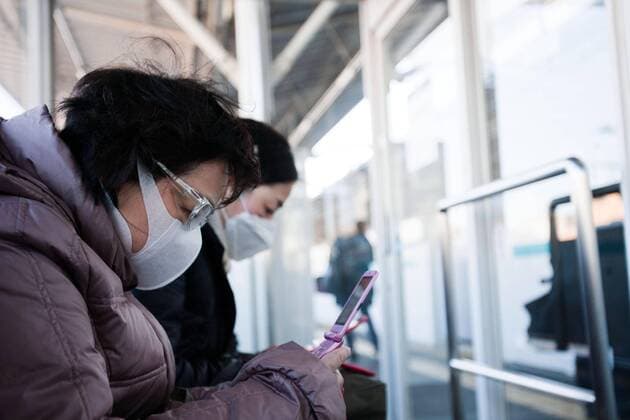 March 17, 2011, Tokyo, Japan - A Japanese commuter is seen wearing a mask and goggles to protect herself from the high radiation levels that drifted to Tokyo from the quake-hit nuclear plant in Fukushima. The radiation fears has caused many people to flee from the city to the southern regions of Japan and overseas.  (xjrb000720)