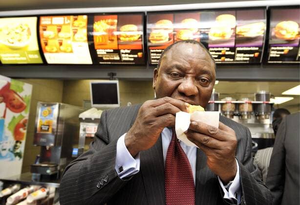 Cyril Ramaphosa takes over McDonalds JOHANNESBURG, SOUTH AFRICA ? 17 March 2011: Cyril Ramaphosa eats a McDonald s burger in Johannesburg, South Africa on 17 March 2011. Ramaphosa announced that he is paying for a 20-year master franchise agreement to run all 145 McDonald s restaurants in South Africa. ( Gallo20114489