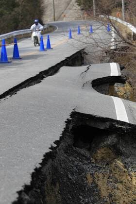 MIYAGI, March 23, 2011 (Xinhua) -- Cracks are seen on a road in Oshika Peninsula, Miyagi Prefecture, Japan, March 23, 2011. The Oshika Peninsula slip southeast about 5.3 meters and subside about 1.2 meters after the massive quake on March 11. (Xinhua Ren Zhenglai) JAPAN-MIYAGI-OSHIKA PENINSULA-DAMAGE 
