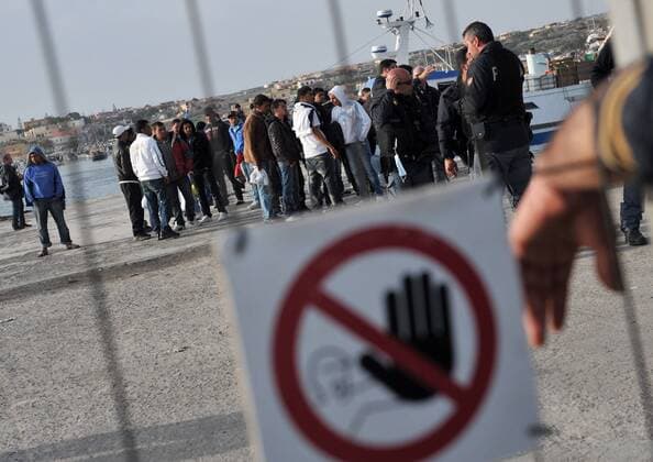 (110328) -- LAMPEDUSA, March 28, 2011 (Xinhua) -- Illegal immigrants from north Africa are checked upon landing on Lampedusa Island, southernmost Italy, March 28, 2011. Another influx of some 3,700 immigrants have poured in Lampedusa in recent days in the wake of turmoil in Tunisia and Libya. Italy will send six ships with a total capacity of 10,000 Wednesday to ease the pressure on the overcrowded southern island. (Xinhua Wang Qingqin) (zw) ITALY-LAMPEDUSA-LIBYA-NORTH AFRICAN IMMIGRANTS 
