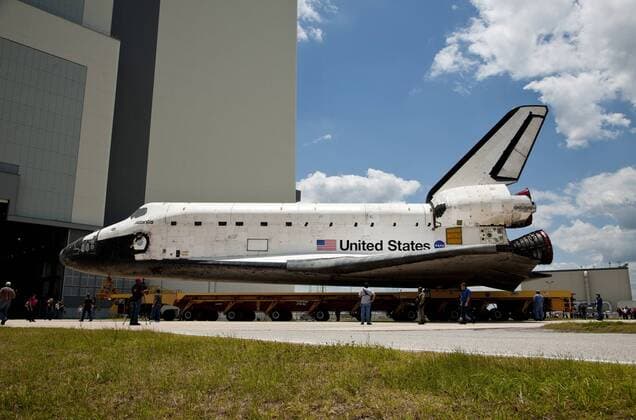NASA s space shuttle Atlantis rolls over from the Orbiter Processing Facility to the Vehicle Assembly Building at the Kennedy Space Center, Florida on May 17, 2011. Atlantis is scheduled to launch a crew of four on the final space shuttle mission, STS 135, sometime in mid-July. Atlantis will deliver equipment and supplies to support the orbiting outpost during the post shuttle era.  KSP20110517037