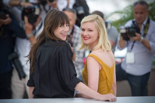 FRANCE, Cannes : French actress Charlotte Gainsbourg and US actress Kirsten Dunst pose during the photocall of Melancholia presented in competition at the 64th Cannes Film Festival on May 18, 2011 in Cannes. 