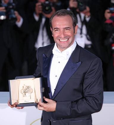 Jean Dujardin arrives at the award photocall after receiving the Best Actor prize for the film The Artist during the 64th annual Cannes International Film Festival in Cannes, France on May 22, 2011.  CAN20110522750