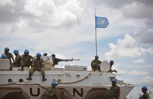(110525) - ABYEI(SUDAN), May 25, 2011 (Xinhua) - The photo taken on May 24, 2011, and released by the United Nations Mission in Sudan (UNMIS) on May 25, 2011, shows Zambian soldiers serving with the international peacekeeping operation waiting to depart on a patrol around Abyei town. The United Nations Mission in Sudan (UNMIS) on Tuesday said more than 15,000 civilians have fled Abyei to Agok area in south Sudan after the Sudanese Armed Forces (SAF) had controlled Abyei.(Xinhua UNMIS PHOTO Stuart Price) (lhh) SUDAN-ABYEI-CONFLICT 