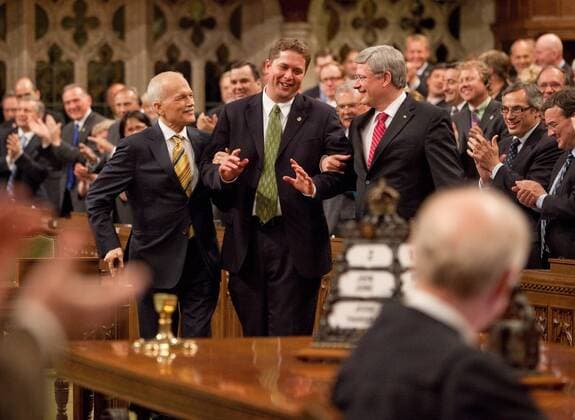 (110603) -- OTTAWA, June 3, 2011 (Xinhua) -- Canada s Prime Minister Stephen Harper (R front) and New Democratic Party leader Jack Layton (L front) lead House of Commons Speaker Andrew Scheer (C front) to the speaker s chair after he was elected in the House of Commons on Parliament Hill in Ottawa, Canada, June 2, 2011. Andrew Scheer, 32, was elected as the speaker of Canada s House of Commons on Thursday, becoming the youngest person ever to hold that post. (Xinhua Jill Thompson) (yc) CANADA-OTTAWA-SCHEER-YOUNGEST SPEAKER 