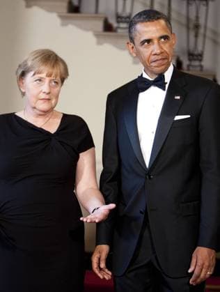 U.S. President Barack Obama and Angela Merkel, chancellor of Germany speak as they pose for a portrait at the White House in Washington, D.C., U.S., on Tuesday, June 7, 2011. PhotographerxJoshuaxRobertsx xBloombergx 