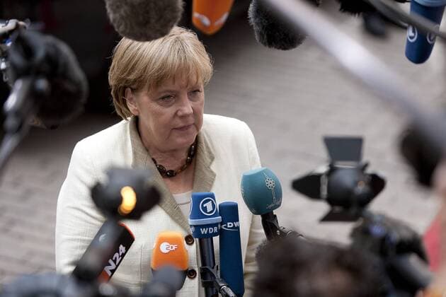 (110721) -- BRUSSELS, July 21, 2011 (Xinhua) -- German Chancellor Angela Merkel receives interviews upon her arrival at the European Council building in Brussels, capital of Belgium, July 21, 2011. Top eurozone leaders held a summit on Thursday to outline a second bail-out for debt-ridden Greece. (Xinhua Thierry Monasse)(ww) BELGIUM-BRUSSELS-EUROZONE-EMERGENCY SUMMIT 