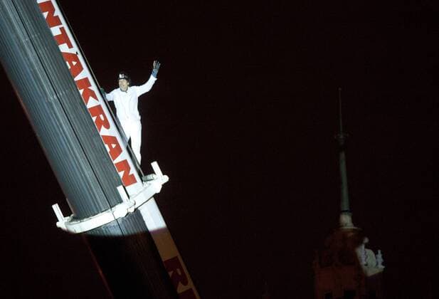 ITAR-TASS: MOSCOW, RUSSIA. SEPTEMBER 29, 2011. Swiss tightrope artist Freddy Nock climbs a crane before his unsuccessful attempt to walk across a tightrope over the Moskva River at a height of 30 metres. Nock performed his stunt in central Moscow, near Gorky Park, on the eve of the 5th World Festival of Circus Art.  RE0EF275