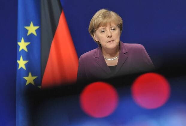 (111103) -- CANNES, Nov. 3, 2011 (Xinhua) -- German Chancellor Angela Merkel and French President Nicolas Sarkozy (not in the picture) attend a press conference after a meeting on Greek situation in Cannes, south France, Nov. 2, 2011. Sarkozy and Merkel promised further help to Greece while urging the referendum announced by Greek Prime Minister George Papandreou to be held as soon as possible, in order to ease market uncertainties. (Xinhua Wu Wei)(ctt) FRANCE-CANNES-EURO-GREECE 