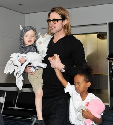 Actor Brad Pitt with son Knox Leon and daughter Zahara Marley at Haneda International Airport as they leave Tokyo, Japan on November 10, 2011. They were in Tokyo for the Japanese premiere of Pitt s movie Moneyball .  TKP201111101222