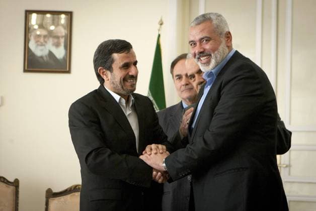 (120212) -- TEHRAN, Feb. 12, 2012 (Xinhua) -- Iranian President Mahmoud Ahmadinejad (L) shakes hands with visiting Hamas leader Ismail Haniyeh during their meeting in Tehran, capital of Iran, on Feb. 12, 2012. (Xinhua Ahmad Halabisaz) (nxl) IRAN-TEHRAN-AHMADINEJAD-HAMAS-HANIYEH-MEETING 