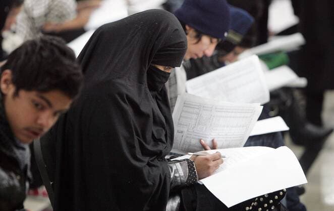 (120220) -- KABUL, Feb. 20, 2012 (Xinhua) -- Afghan graduates attend the university entry exam in Kabul, capital of Afghanistan, Feb. 20, 2012. The first phase of university entry exam was held in Kabul on Monday and over 12,000 high school graduates including 5,500 girls took part to find their way for higher education, according to Afgan Deputy Minister for Higher Education on student affairs Barai Siddiqi. (Xinhua Ahmad Massoud) (dzl) AFGHANISTAN-KABUL-UNIVERSITY ENTRY EXAM 