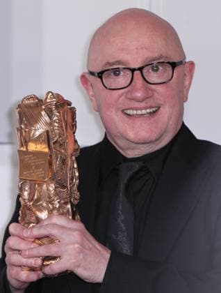 (120224) -- PARIS, Feb. 24, 2012 (Xinhua) -- French actor Michel Blanc poses with the trophy after winning the Best Supporting Actor award for French director Pierre Schoeller s film L exercice de l Etat (The Minister) at the 37th Cesar Awards ceremony in Paris, France, Feb. 24, 2012. (Xinhua Gao Jing) (ypf) FRANCE-PARIS-CESAR AWARD-ARRIVALS 