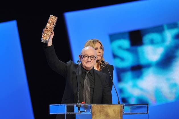 (120225) -- PARIS, Feb. 25, 2012 (Xinhua) -- French actor Michel Blanc (L) gestures after receiving the Cesar Award for Best Supporting Actor at the 37th Cesar Awards ceremony at the Chatelet theater in Paris, capital of France, on Feb. 24, 2012. (Xinhua) (nxl) FRANCE-PARIS-CESAR AWARDS 