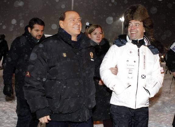 ITAR-TASS: SOCHI, RUSSIA. MARCH 8, 2012. Former Italian prime minister Silvio Berlusconi, and Russia s incumbent president Dmitry Medvedev (L-R front) during their informal meeting at Krasnaya Polyana ski resort, Sochi.  RE0F98DC