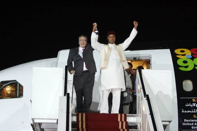 (120520) -- TRIPOLI, May 20, 2012 (Xinhua) -- The file photo taken on Aug. 20, 2009 shows that Abdel Baset al-Megrahi (L) and Saif al-Islam Gaddafi arrive in Tripoli, Libya. Abdel Baset al-Megrahi, who was the only person convicted in the case of the Lockerbie bombing in 1988 that killed 270 people, died on May 20, 2012. (Xinhua Hamza Turkia) (zjl) LIBYA-TRIPOLI-LOCKERBIE BOMBING-CONVICT-DEATH 