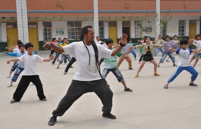 WENXIAN, CHINA - MAY 31: (CHINA OUT) Poet Benjamin Zephaniah visits Chenjiagou primary school before the June 1 International Children s Day on May 31, 2012 in Wenxian County, Henan Province of China.  CFP428571881