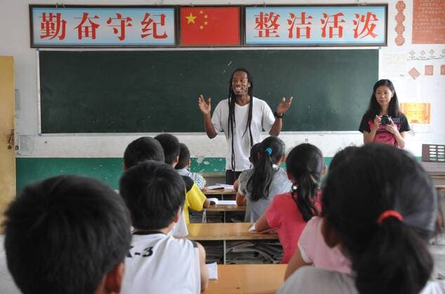 WENXIAN, CHINA - MAY 31: (CHINA OUT) Poet Benjamin Zephaniah visits Chenjiagou primary school before the June 1 International Children s Day on May 31, 2012 in Wenxian County, Henan Province of China.  CFP428571883