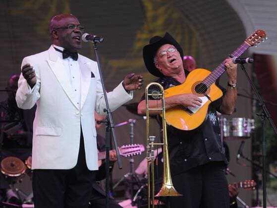 ITAR-TASS: MOSCOW, RUSSIA. JULY 15, 2012. Jesus Aguaje Ramos, a trombonist and vocalist, Eliades Ochoa, a guitarist and vocalist, L-R, of the legendary music ensemble the Buena Vista Social Club from Havana, Cuba, performing at Hermitage Garden.  RE10335B