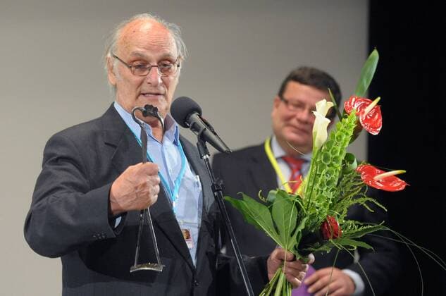Famous Spanish film director Carlos Saura, left, received the annual award of the Association of Czech Film Clubs (ACFK) from Defence Minister Alexandr Vondra, right, at the official opening of the 38th Summer Film School festival in Uherske Hradiste, Czech Republic, on Saturday, July 21, 2012. Saura was awarded for his creative approach to film-making and his depiction of time in human psyche. (CTKxPhoto ZdenekxNemec).  CTKPhoto381201207210411701