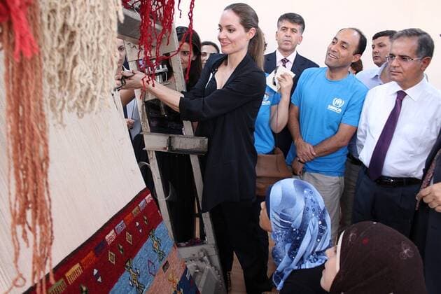 Actress and UN special envoy Angelina Jolie arrives with UN High Commissioner for Refugees Antonio Guterres on September 13, 2012 at a refugee camp in the southeastern Turkish city of Kilis to meet Syrian refugees. Jolie visited the Oncupinar camp with some 12,000 refugees, Turkey s largest camp for Syrian refugees near the border. 