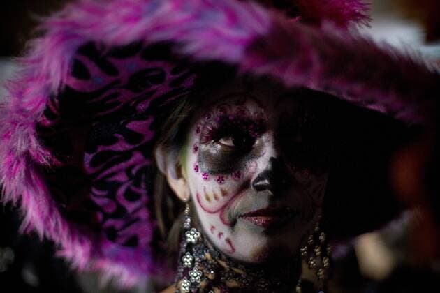 A resident participates in an offerings exposition, during the Day of the Dead celebrations in Universitary City, Mexico City, capital of Mexico, on Oct. 30, 2012. (Xinhua Pedro Mera)(ctt) MEXICO-MEXICO CITY-SOCIETY-DAY OF DEAD 