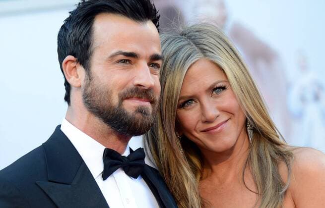Jennifer Aniston and Justin Theroux arrive on the red carpet at the 85th Academy Awards at the Hollywood and Highlands Center in the Hollywood section of Los Angeles on February 24, 2013.  LAP20130224A252