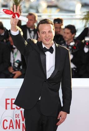 Amat Escalante arrives at the award photocall after receiving the Prix de la mise en scene (Best Director) prize for the film Heli during the 66th annual Cannes International Film Festival in Cannes, France on May 26, 2013.  CAN20130526762