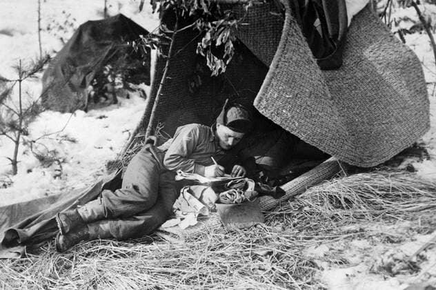 Under a shelter of matting with straw spread over the snow , Sergeant Daniel Campbell of the Argyll and Sutherland Highlanders . writes a letter to his family in Glasgow during a break in action against the Chinese Communist Forces in Korea . 12 February 1951 UnitedArchives00121042 