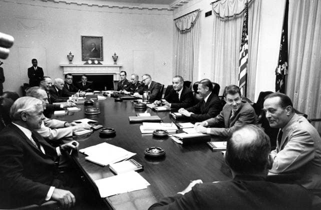 Cabinet Room of the White House just recently when the President Lyndon B Johnson met his top defence advisors on the Vietnam Situation. Around the table are left to right: Secretary of the Navy Paul Nitze, Admiral David L McDonald, Chief of Naval Operations General John McConnell, chief of Staff Air Force Eugene Zuckert, Secretary of the Air Force (outgoing) Harold Brown, Secretary of the Air Force Designate; Presidential Assistant Jack Valenti, General Wallace M Greene Commandant Marine Corps, General Harold K Johnson Army Chief of Staff, Stanley Resor Secretary of the Army, President Johnson, Robert McNamara Secretary of Defense, Deputy Secretary of Defence Cyrus Vance, General Earle G Wheeler Chairman of the Joint Chiefs of Staff, and McGeorge Bundy Presudential Advisor 27th July 1965 UnitedArchives00123237