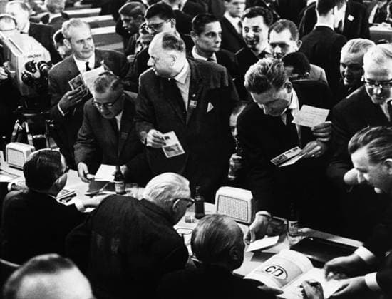 Unusual opportunity for autograph hunters ... during the German Christian Democratic Congress at Dusseldorf . Busy signing (centre, foreground ) are the Chancellor Dr Ludwig Erhard , Dr Konrad Adenauer , Party Chief and former Chancellor. CDU 1st April 1965, Düsseldorf UnitedArchives00153409 
